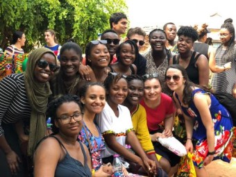 Students posing in a group while on a trip in Ghana