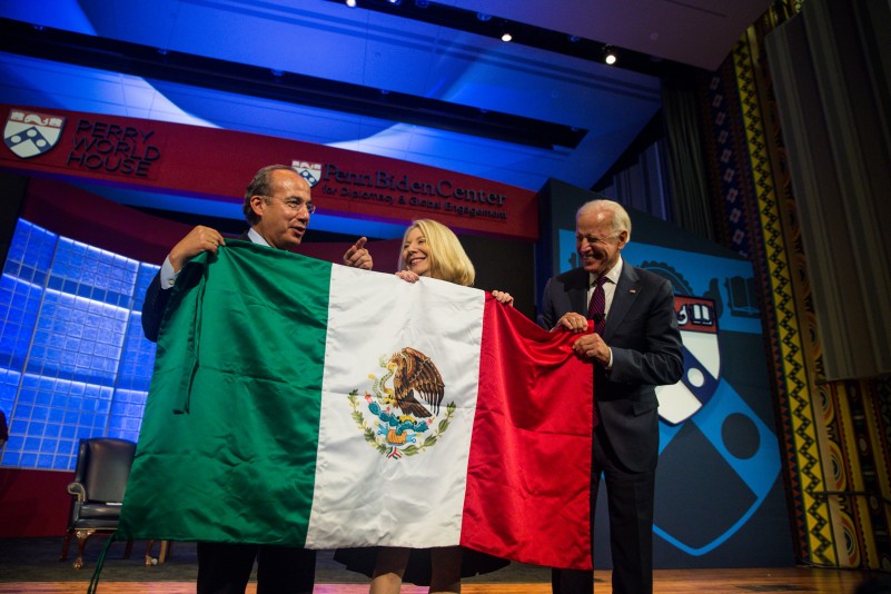 President Calderon, Penn President Gutmann and Joe Biden hold up the Mexican flag